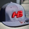 Headbanger Sports I8501 Cap America Flexfit Performance Trucker Mesh Back Hat: Graphite / Red